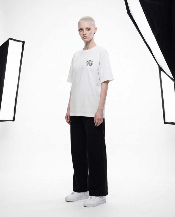 Outlaw Circle Back Tee - White - Three-Quarter — Cor Leonis SS26